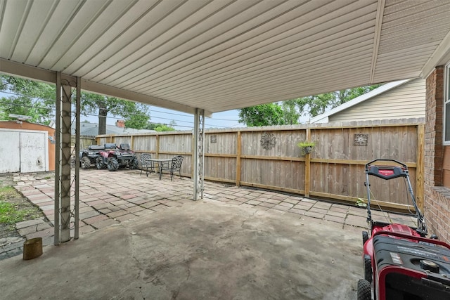 14018 Duncannon Dr, Houston, TX 77015 - fenced backyard with a patio area and a storage shed