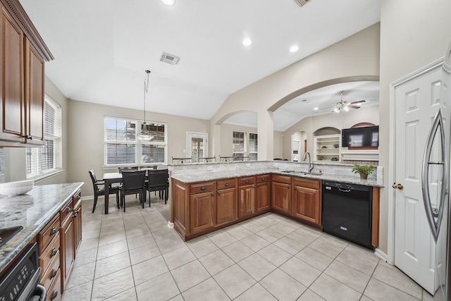 3343 Summerwood Ln, Pearland, TX 77584 - kitchen featuring black dishwasher, ceiling fan, lofted ceiling, brown cabinetry, and light stone countertops