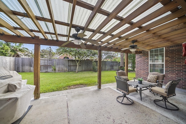 3343 Summerwood Ln, Pearland, TX 77584 - fenced backyard with a ceiling fan, a patio, an outdoor hangout area, and a pergola