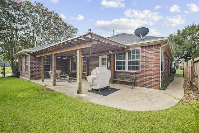 3343 Summerwood Ln, Pearland, TX 77584 - back of property with ceiling fan, brick siding, a fenced backyard, and a patio area