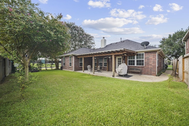 3343 Summerwood Ln, Pearland, TX 77584 - rear view of property featuring brick siding, a fenced backyard, a chimney, and a patio area