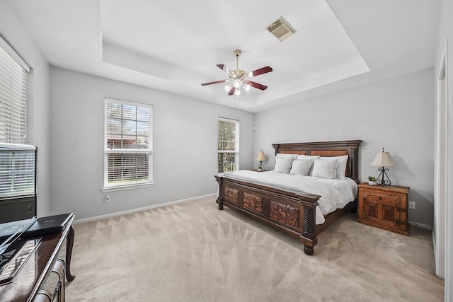 3343 Summerwood Ln, Pearland, TX 77584 - carpeted bedroom with a raised ceiling and a ceiling fan