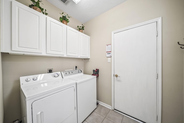 3343 Summerwood Ln, Pearland, TX 77584 - laundry room featuring cabinet space, separate washer and dryer, and light tile patterned flooring