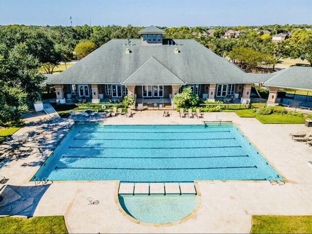 3343 Summerwood Ln, Pearland, TX 77584 - outdoor pool featuring a patio