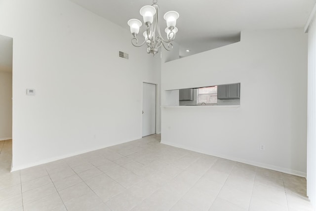 6306 Clayridge Dr, Houston, TX 77053 - unfurnished room with high vaulted ceiling, a chandelier, and light tile patterned floors