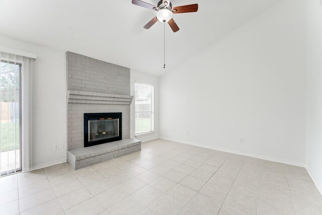 6306 Clayridge Dr, Houston, TX 77053 - unfurnished living room featuring a ceiling fan, vaulted ceiling, a brick fireplace, and tile patterned flooring