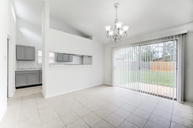 6306 Clayridge Dr, Houston, TX 77053 - unfurnished dining area featuring a chandelier, lofted ceiling, and light tile patterned floors