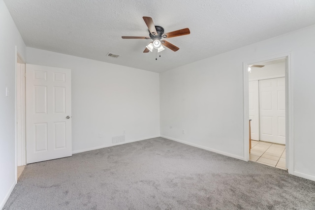 6306 Clayridge Dr, Houston, TX 77053 - carpeted empty room with ceiling fan and a textured ceiling