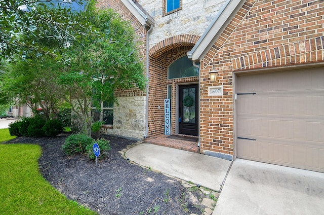 3707 Brampton Island Dr, Katy, TX 77494 - entrance to property featuring stone siding, brick siding, and an attached garage