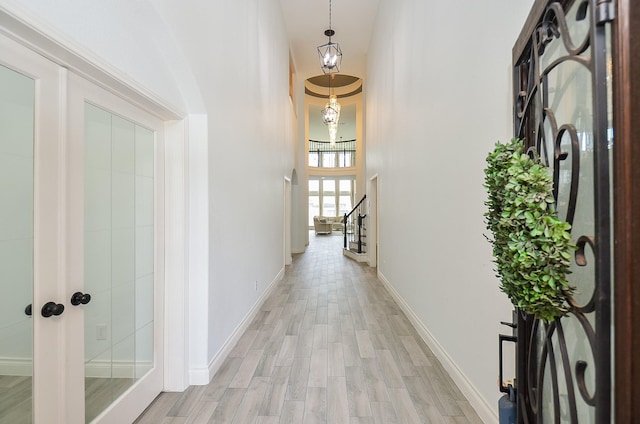3707 Brampton Island Dr, Katy, TX 77494 - hallway featuring light wood-style flooring and a towering ceiling