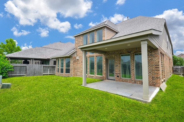 3707 Brampton Island Dr, Katy, TX 77494 - rear view of house with brick siding, a patio, and roof with shingles