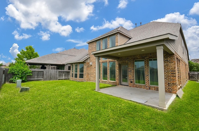 3707 Brampton Island Dr, Katy, TX 77494 - rear view of house with brick siding, a fenced backyard, a patio area, and roof with shingles