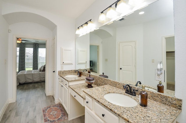 3707 Brampton Island Dr, Katy, TX 77494 - ensuite bathroom with double vanity, a ceiling fan, and wood finished floors