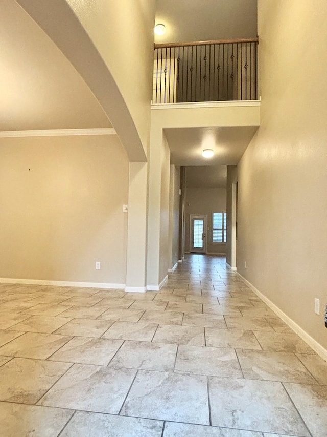 24514 Lake Path Cir, Katy, TX 77493 - foyer with a high ceiling, stone tile floors, arched walkways, and crown molding