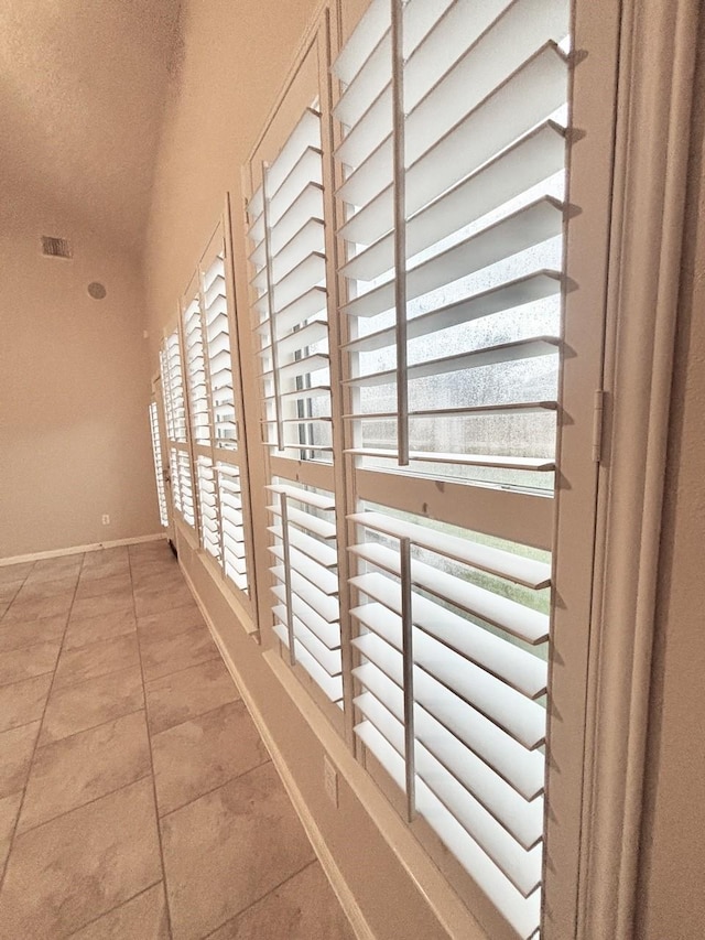 24514 Lake Path Cir, Katy, TX 77493 - hallway with baseboards and light tile patterned floors