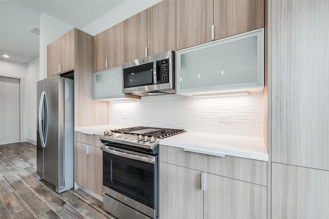 4402 Santorini Ln, Houston, TX 77045 - kitchen with appliances with stainless steel finishes, modern cabinets, and light countertops