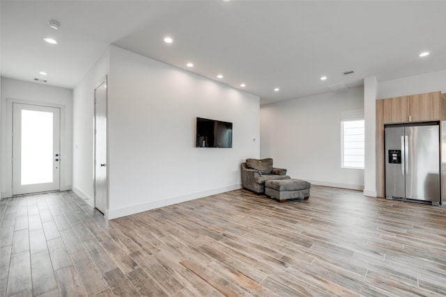 4402 Santorini Ln, Houston, TX 77045 - unfurnished room featuring light wood-type flooring and recessed lighting