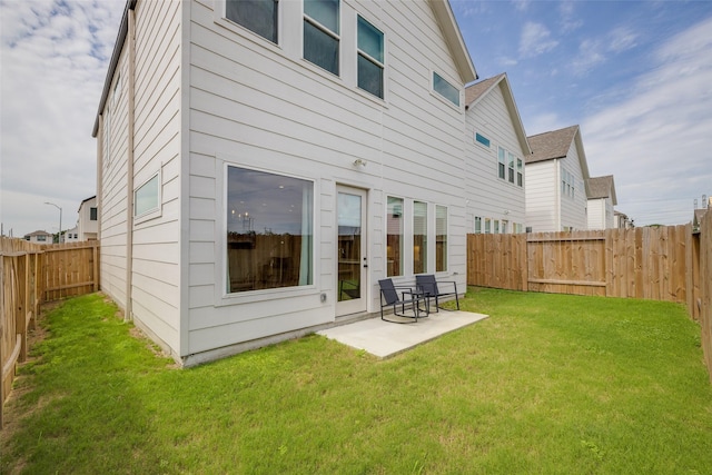4402 Santorini Ln, Houston, TX 77045 - back of property featuring a patio and a fenced backyard
