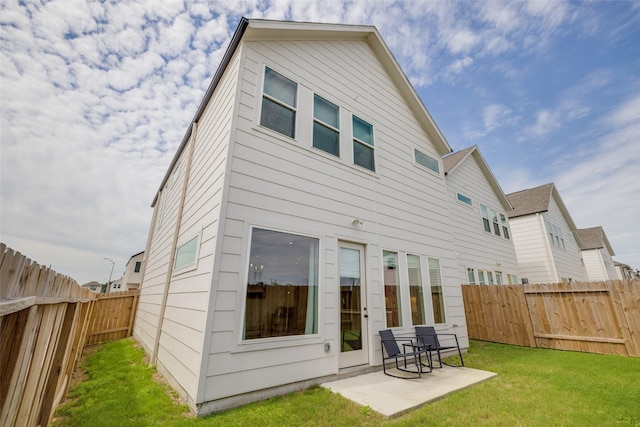 4402 Santorini Ln, Houston, TX 77045 - rear view of property featuring a fenced backyard and a patio