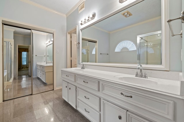 5802 Ashmere Ln, Spring, TX 77379 - bathroom with double vanity, crown molding, and a shower