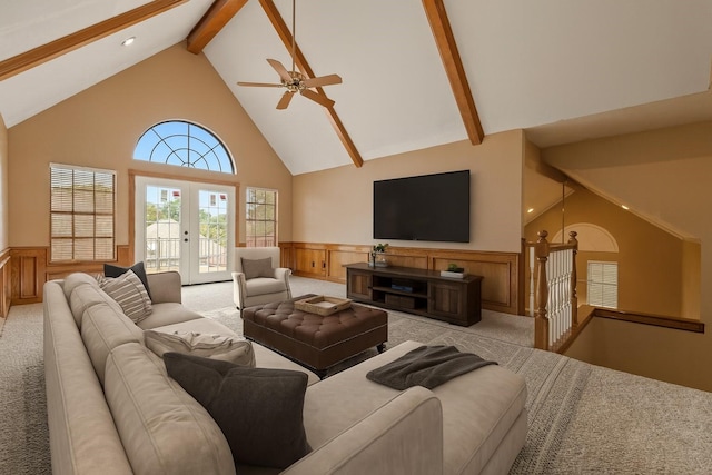 5802 Ashmere Ln, Spring, TX 77379 - living area with wainscoting, beam ceiling, high vaulted ceiling, light colored carpet, and french doors