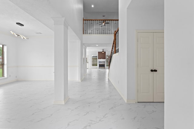 13611 Ortega Ln, Houston, TX 77083 - hallway featuring light marble finish flooring, stairway, and recessed lighting