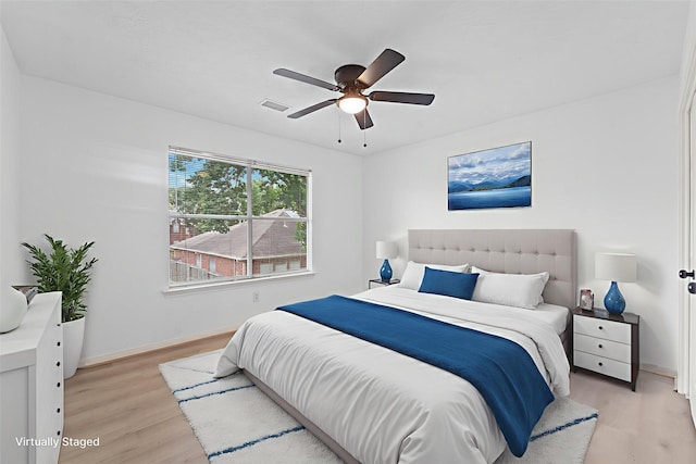 13611 Ortega Ln, Houston, TX 77083 - bedroom featuring light wood-style flooring and ceiling fan
