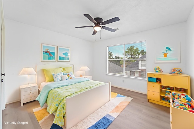 13611 Ortega Ln, Houston, TX 77083 - bedroom with light wood-style floors and a ceiling fan