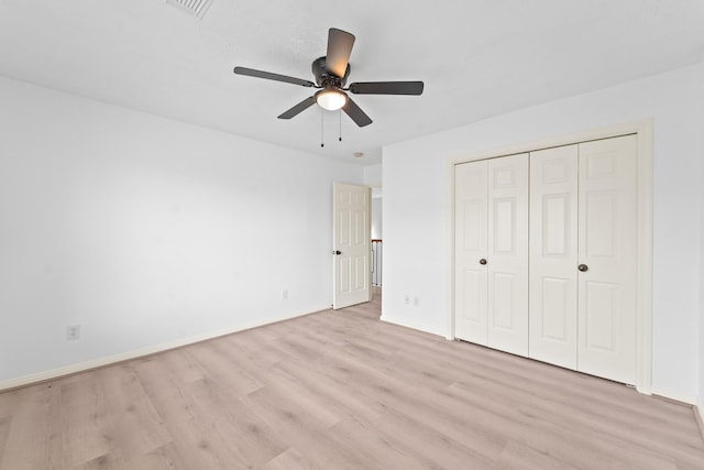 13611 Ortega Ln, Houston, TX 77083 - unfurnished bedroom with light wood-style flooring, a closet, and ceiling fan