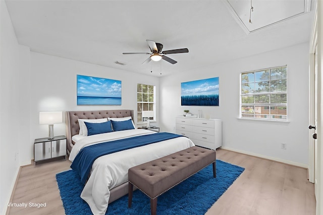 13611 Ortega Ln, Houston, TX 77083 - bedroom with attic access, light wood-type flooring, and ceiling fan