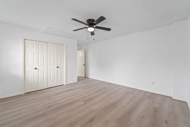 13611 Ortega Ln, Houston, TX 77083 - unfurnished bedroom with attic access, light wood-style floors, a closet, and ceiling fan