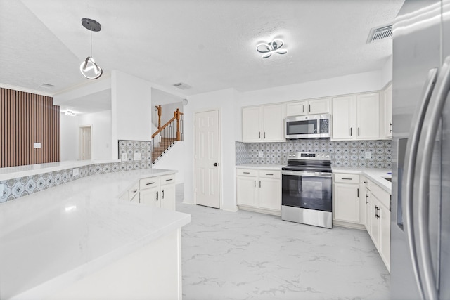 13611 Ortega Ln, Houston, TX 77083 - kitchen featuring stainless steel appliances, tasteful backsplash, white cabinets, light countertops, and a textured ceiling
