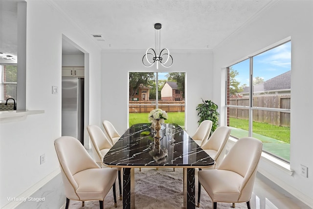 13611 Ortega Ln, Houston, TX 77083 - dining area featuring crown molding, healthy amount of natural light, and a chandelier