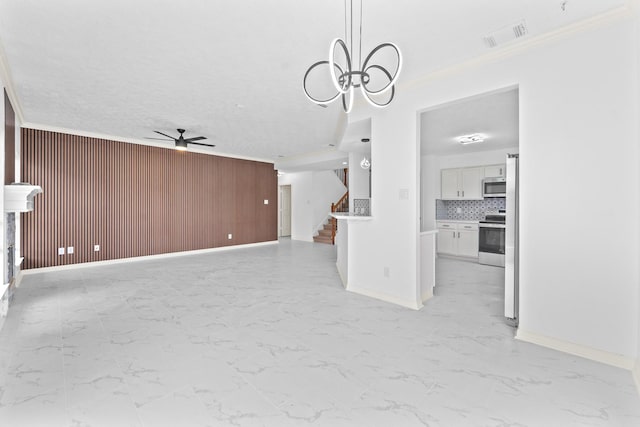 13611 Ortega Ln, Houston, TX 77083 - unfurnished living room with a ceiling fan, stairway, wood walls, ornamental molding, and light marble finish flooring