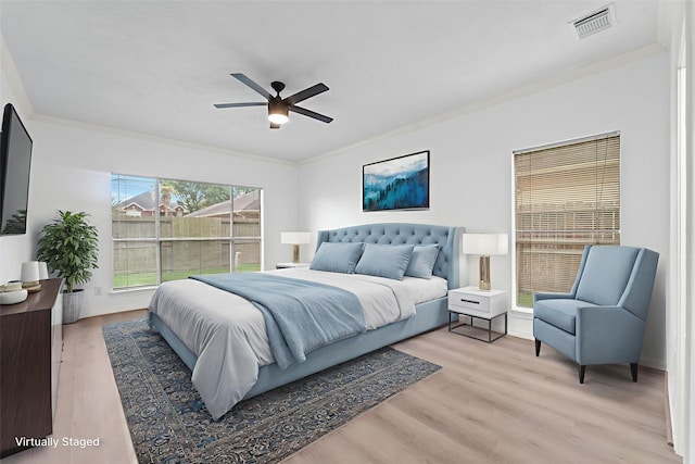 13611 Ortega Ln, Houston, TX 77083 - bedroom featuring ornamental molding, light wood finished floors, and ceiling fan