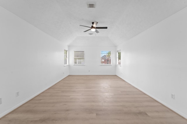 13611 Ortega Ln, Houston, TX 77083 - spare room featuring a ceiling fan, vaulted ceiling, and light wood-type flooring