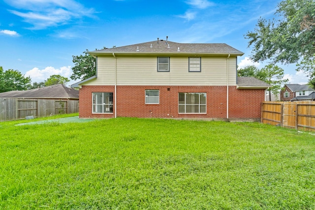 13611 Ortega Ln, Houston, TX 77083 - rear view of property featuring a fenced backyard and brick siding