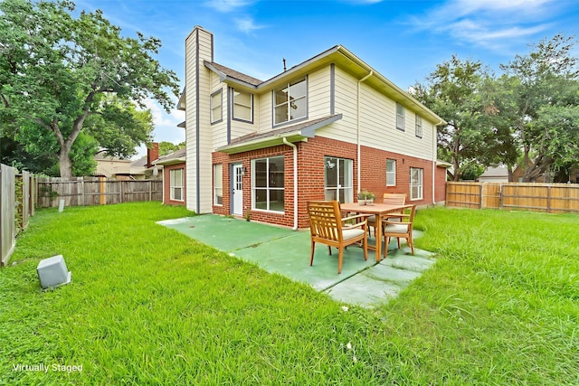 13611 Ortega Ln, Houston, TX 77083 - back of property featuring a chimney, a fenced backyard, brick siding, and a patio