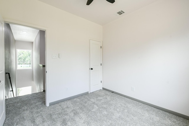 8306 E Tidwell Rd, Houston, TX 77028 - unfurnished bedroom with carpet and a ceiling fan