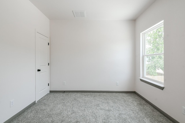 8306 E Tidwell Rd, Houston, TX 77028 - carpeted spare room featuring baseboards