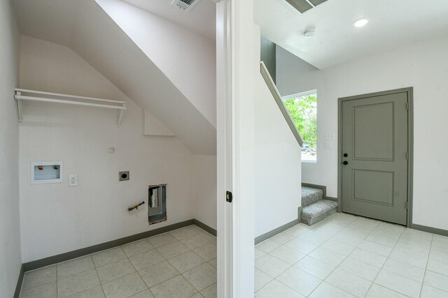 8306 E Tidwell Rd, Houston, TX 77028 - laundry room featuring gas dryer hookup, hookup for an electric dryer, washer hookup, light tile patterned floors, and recessed lighting