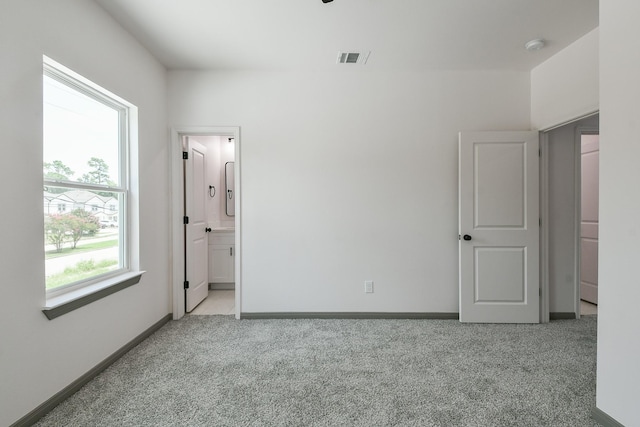 8306 E Tidwell Rd, Houston, TX 77028 - unfurnished bedroom with carpet and baseboards