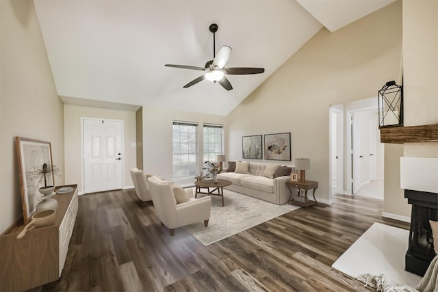 2322 Old Oak Ln, Kingwood, TX 77339 - living room with high vaulted ceiling, ceiling fan, dark wood-style flooring, and a multi sided fireplace
