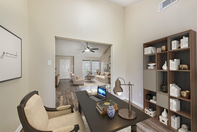 2322 Old Oak Ln, Kingwood, TX 77339 - office area with wood finished floors, a towering ceiling, and ceiling fan