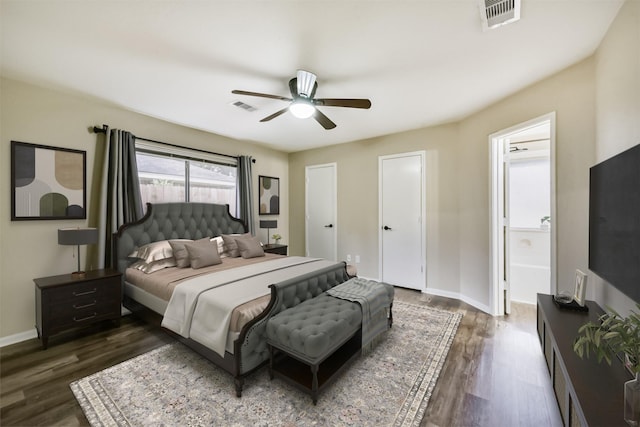 2322 Old Oak Ln, Kingwood, TX 77339 - bedroom featuring dark wood-style floors, ceiling fan, and connected bathroom