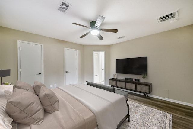 2322 Old Oak Ln, Kingwood, TX 77339 - bedroom with wood finished floors and ceiling fan
