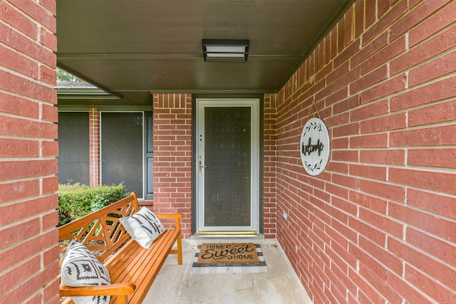 2322 Old Oak Ln, Kingwood, TX 77339 - doorway to property featuring brick siding