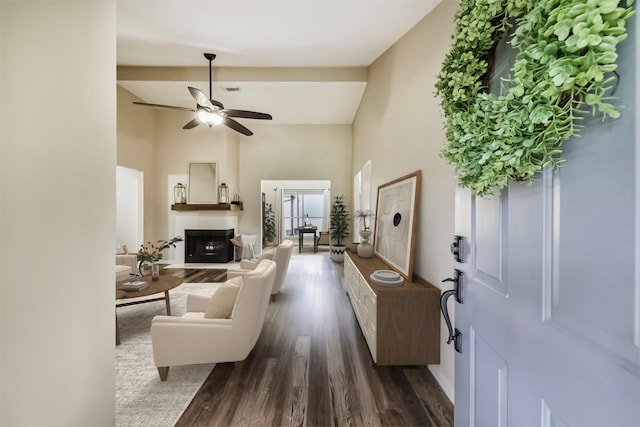 2322 Old Oak Ln, Kingwood, TX 77339 - living area featuring a high ceiling, dark wood finished floors, a fireplace with flush hearth, and ceiling fan