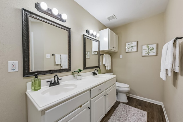 2322 Old Oak Ln, Kingwood, TX 77339 - bathroom with wood finished floors and double vanity