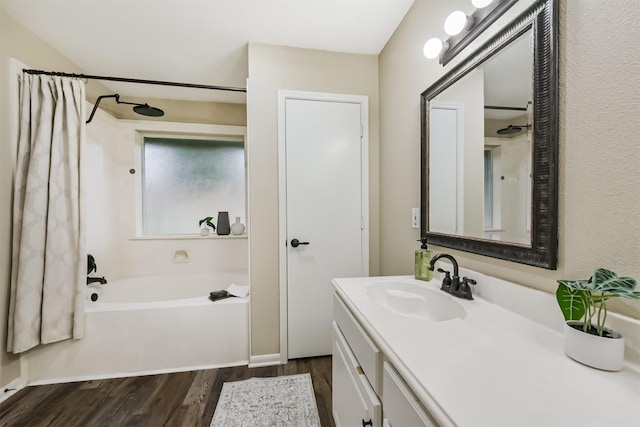 2322 Old Oak Ln, Kingwood, TX 77339 - full bath with wood finished floors, vanity, and shower / bath combo